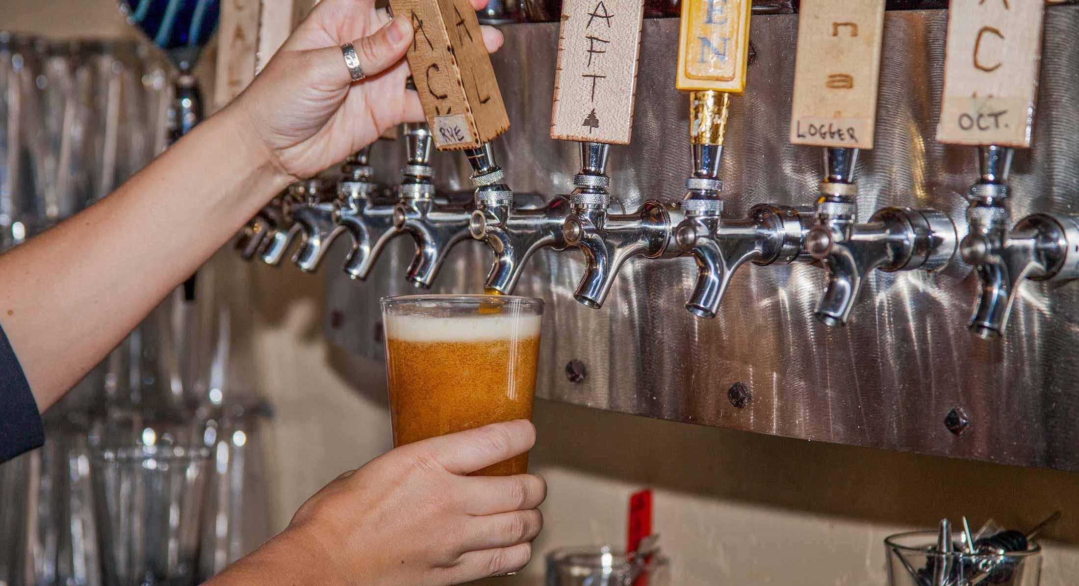 Beer being poured from the tap at Tamarack Brewing in Downtown Missoula