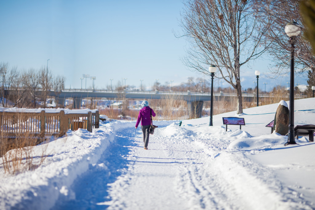 A snowy riverfront walking trail in Downtown Missoula on a winter day