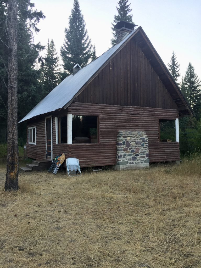 Rustic cabins are available for rent, complete with fire place and mountain vibes.