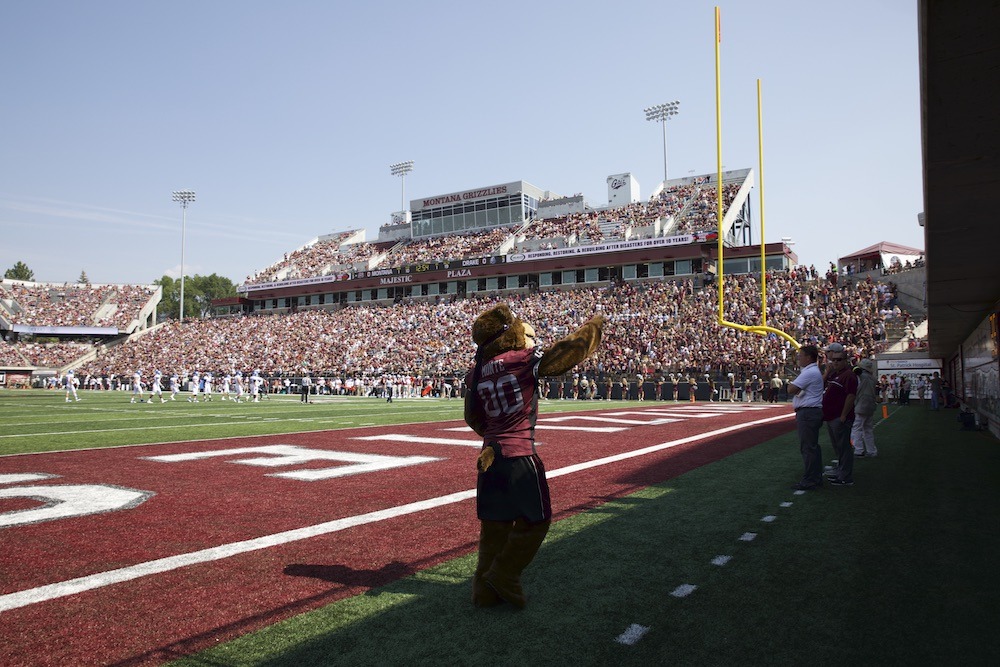 University of Montana Grizzlies Monte waving to the crowd of fans at a Griz football game.